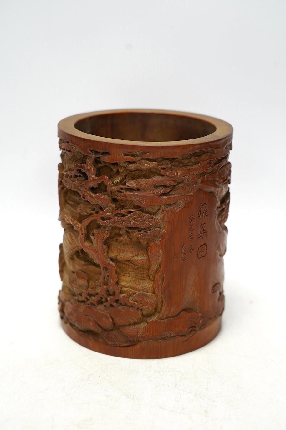 A Chinese carved bamboo 'scholars' brushpot, 15.5cm tall. Condition - fair to good